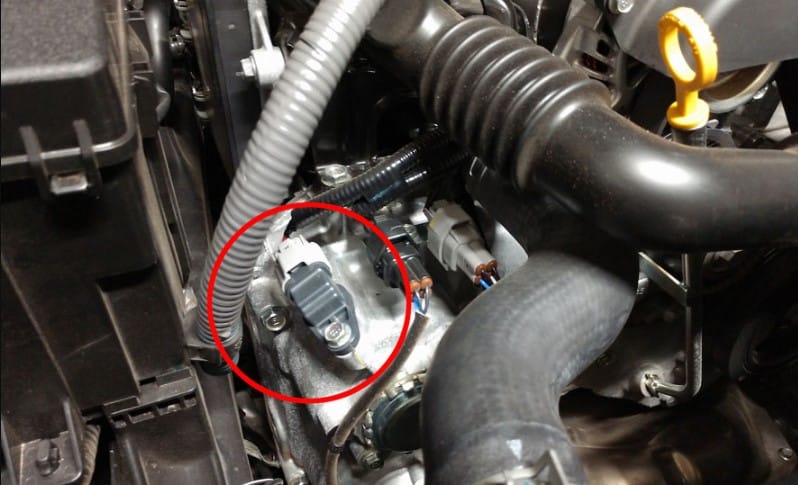 What is a crankshaft position sensor and where is it located