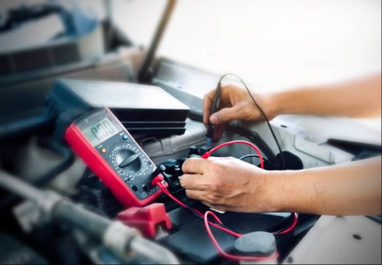 What is a service battery charging system and how does it work