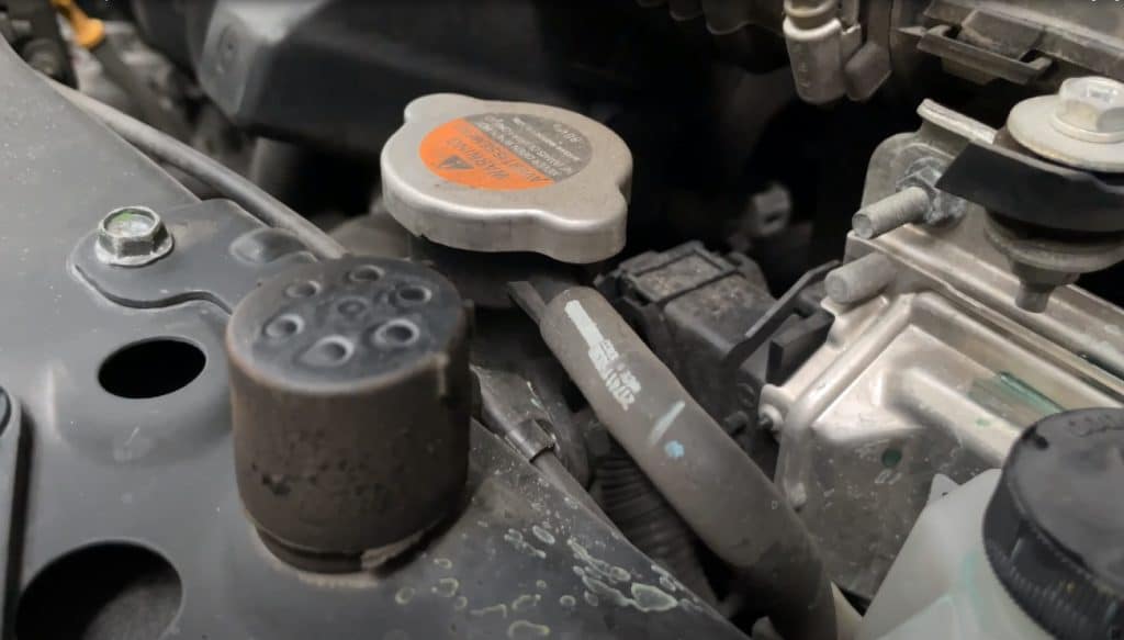 Why Is My Car Smoking Under The Hood? A Detailed Guide