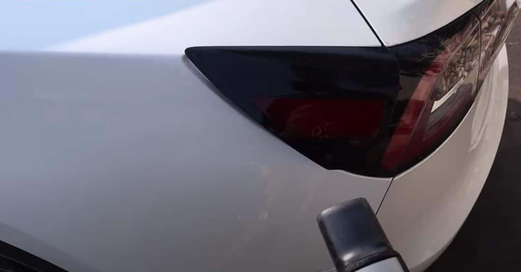 Why Do Tesla Owners Tap The Tail Lightnull