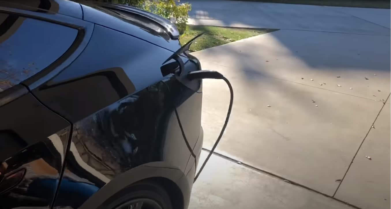 why do tesla owners tap the charger