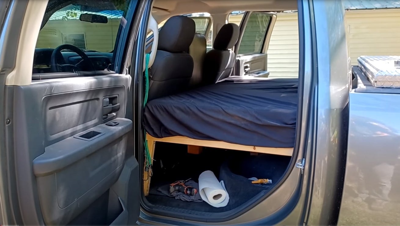 bed in back seat of truck
