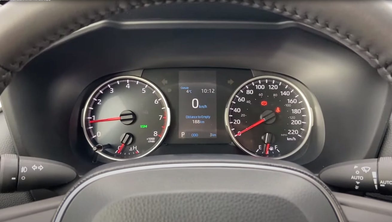 Close-up of computer screens displaying car performance metrics