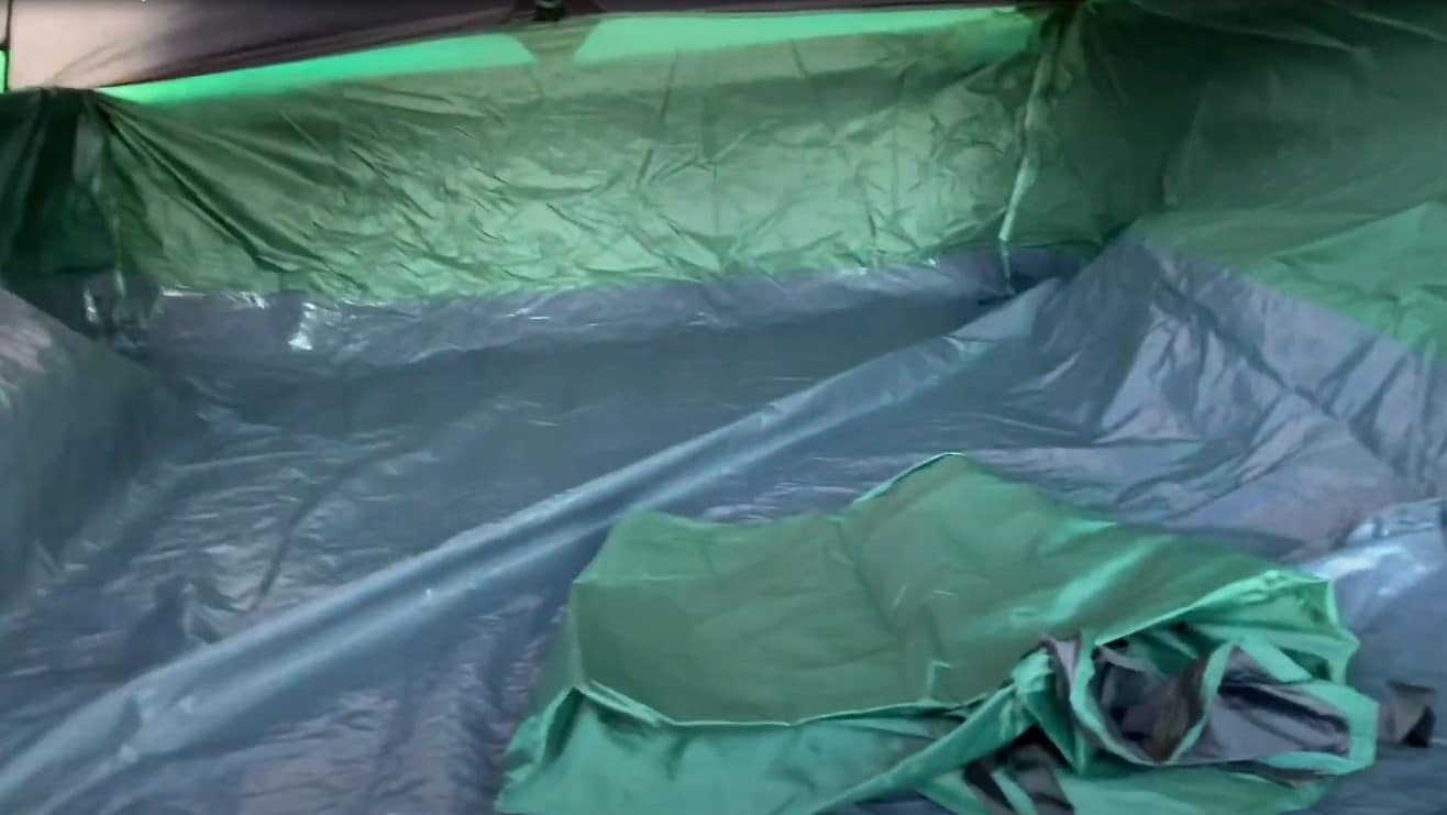 Organized gear inside a truck bed tent